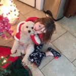 Ellie playing with dog Keller on Christmas