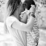 A black and white picture of bailey kissing her daughter Ellie