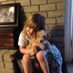 A picture of Ellie Hugging her dog Killer