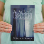 A view of the bailey holding the book A gray faith by Andrew B Heard