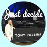 Ellie posing for a picture at the Tony Robbins event